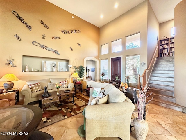 living room with a towering ceiling