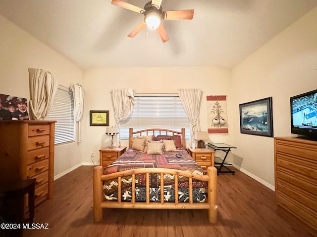 bedroom with ceiling fan and dark hardwood / wood-style flooring