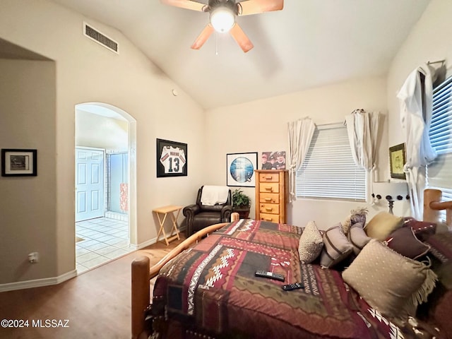 carpeted bedroom with ceiling fan and lofted ceiling