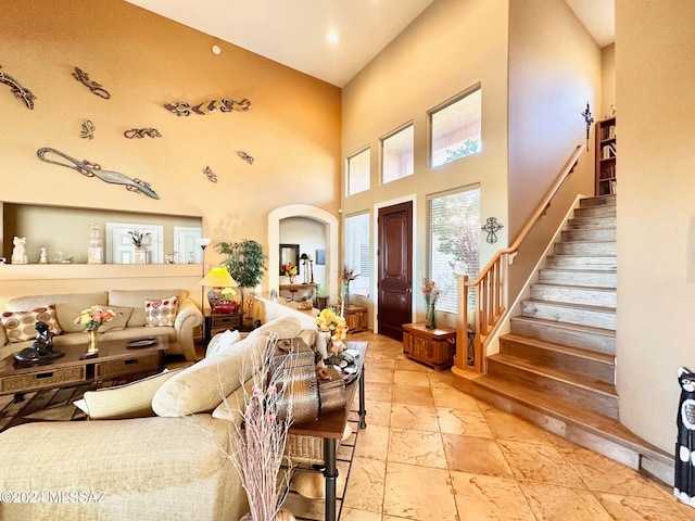 living room with a towering ceiling