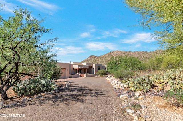 adobe home with a mountain view