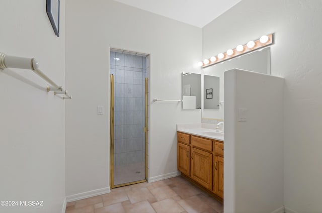 bathroom featuring vanity and an enclosed shower