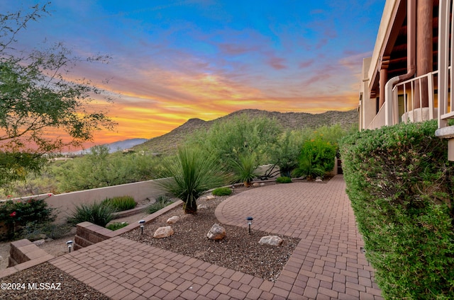 patio terrace at dusk with a mountain view