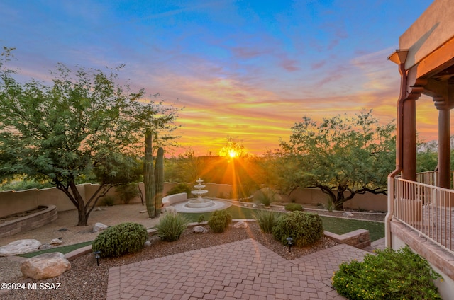 view of patio terrace at dusk