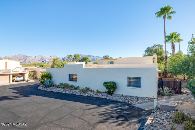 view of front facade featuring a mountain view and a garage