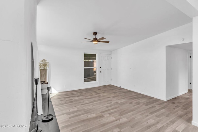 unfurnished living room with baseboards, ceiling fan, and light wood finished floors