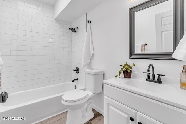 full bathroom featuring vanity, tub / shower combination, wood finished floors, and toilet