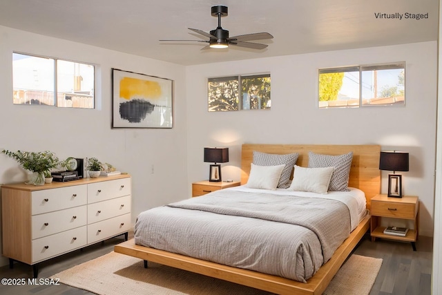 bedroom with dark wood-type flooring