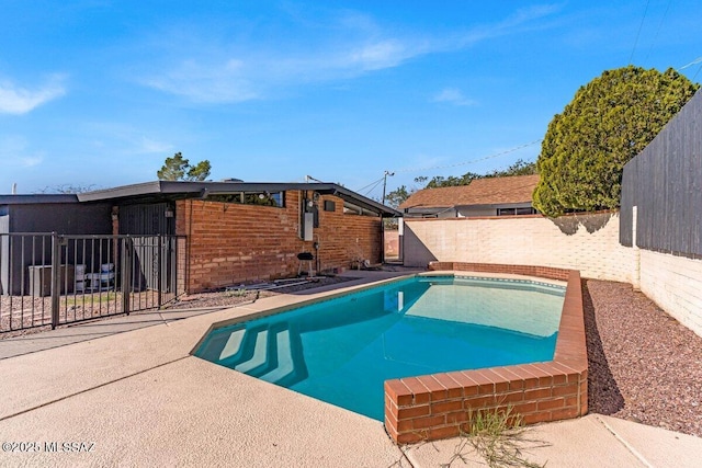 view of pool with a patio area, a fenced backyard, and a fenced in pool