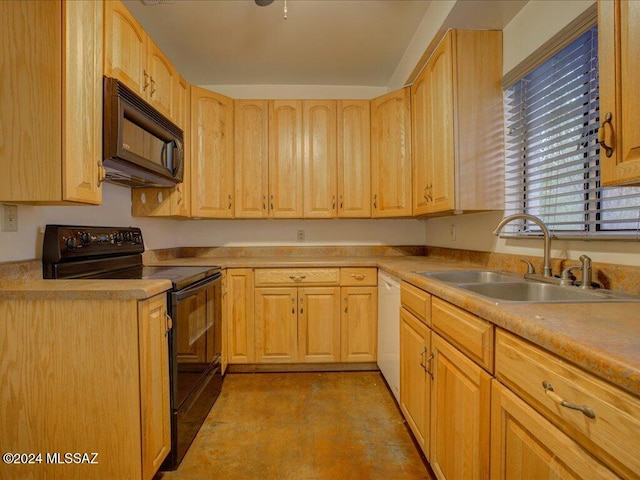 kitchen featuring black appliances, light brown cabinets, and sink