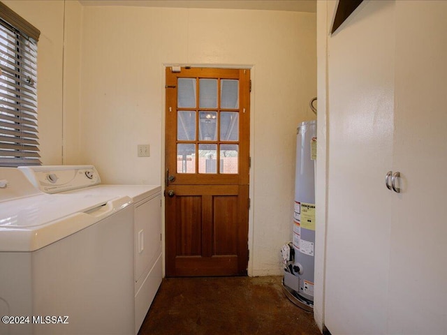 washroom featuring gas water heater and washer and dryer