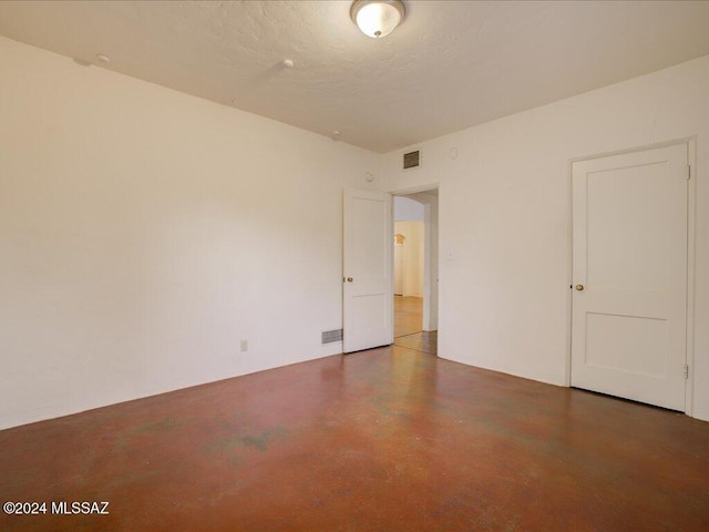 empty room featuring a textured ceiling