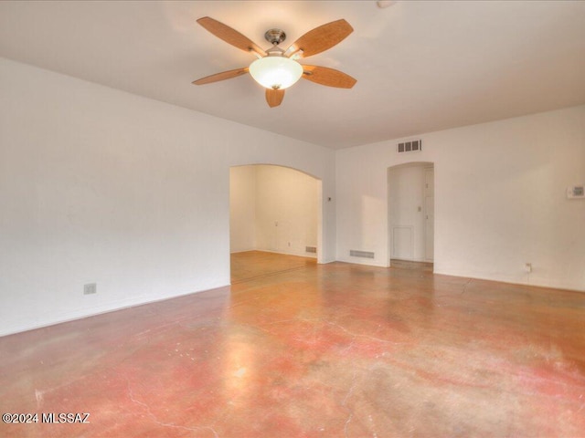 empty room featuring concrete floors and ceiling fan