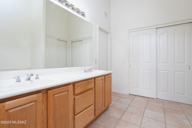 bathroom with vanity and tile patterned floors