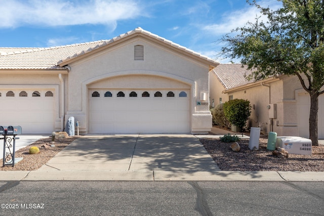 view of front of property with a garage