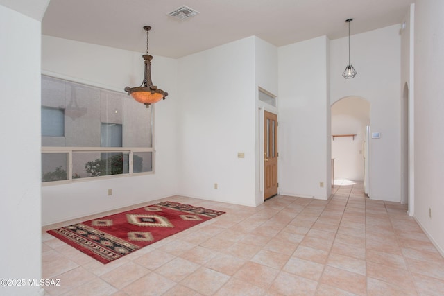 unfurnished room featuring tile patterned flooring