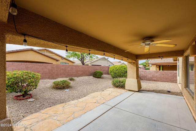 view of patio featuring ceiling fan