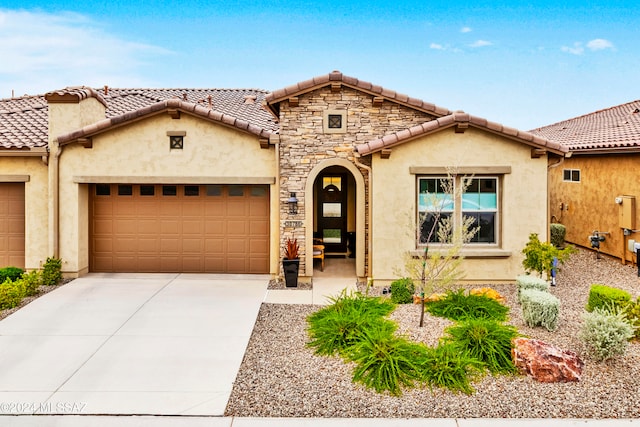 mediterranean / spanish-style house featuring a garage