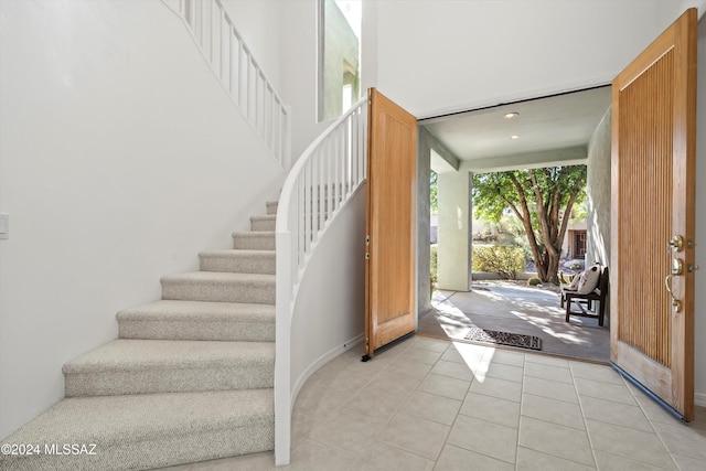 foyer with light tile patterned flooring