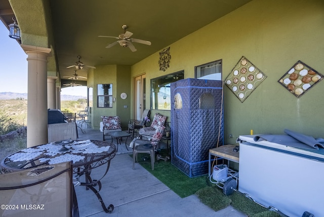 view of patio / terrace featuring ceiling fan