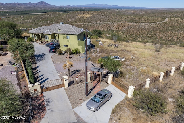 birds eye view of property featuring a mountain view