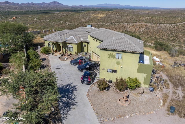 birds eye view of property featuring a mountain view