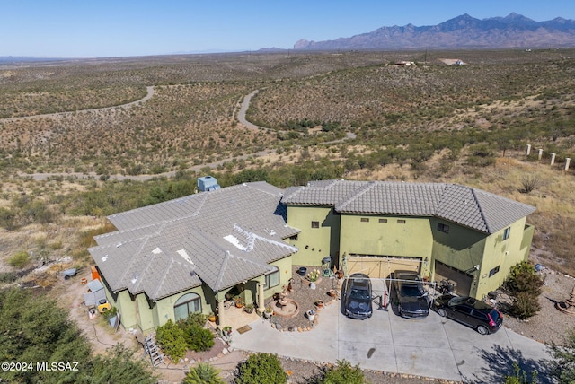 drone / aerial view featuring a mountain view