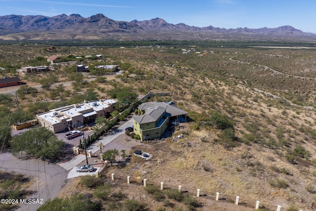 birds eye view of property with a mountain view