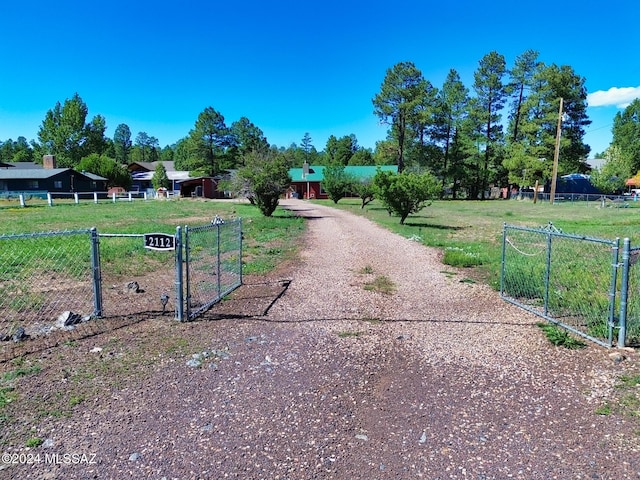 view of property's community featuring a lawn