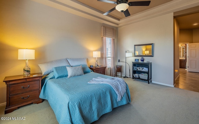 bedroom with light colored carpet and ceiling fan