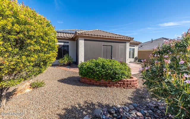 rear view of property featuring a patio