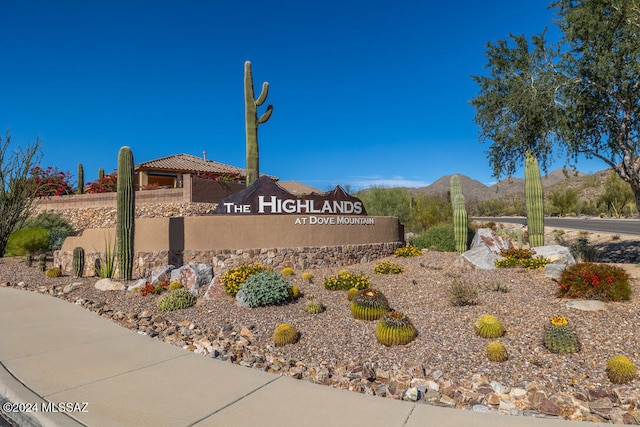 community sign featuring a mountain view