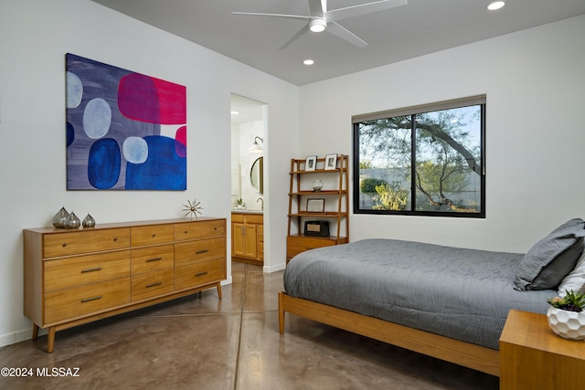 bedroom featuring ceiling fan and connected bathroom