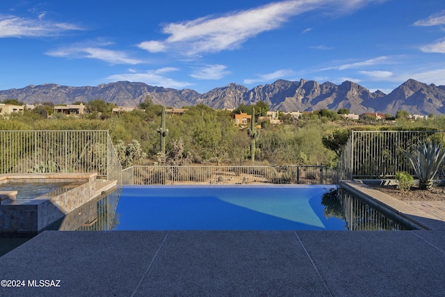 view of pool with a mountain view