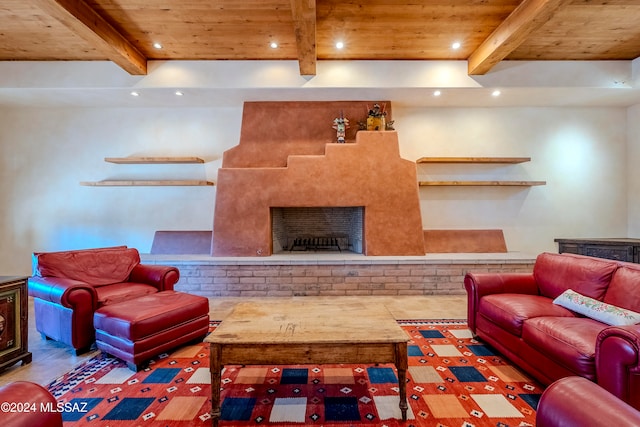 tiled living room with beam ceiling, wooden ceiling, and a fireplace