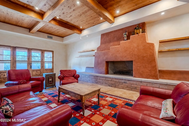 living room featuring beamed ceiling, wood ceiling, and a fireplace