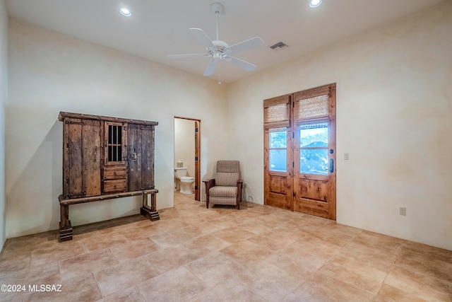 living area with ceiling fan