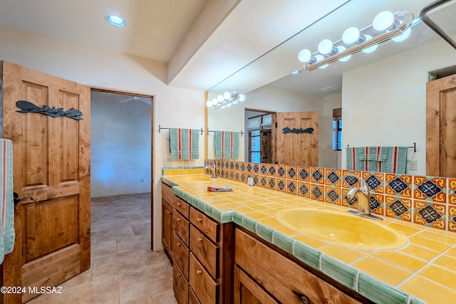 bathroom with decorative backsplash and vanity