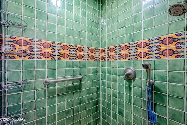 bathroom with a tile shower