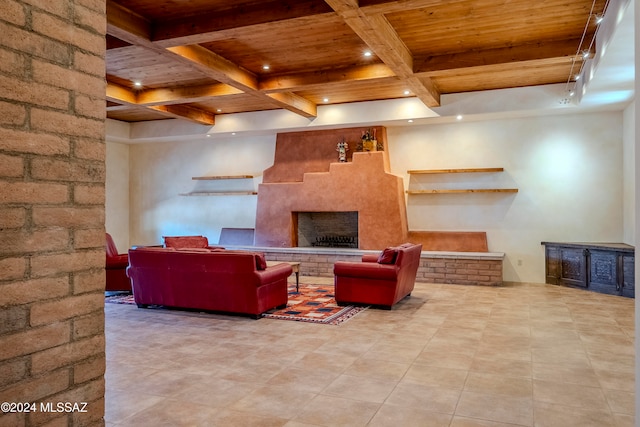 tiled living room featuring a fireplace, beamed ceiling, and wood ceiling