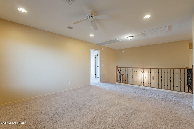 empty room with carpet floors and ceiling fan