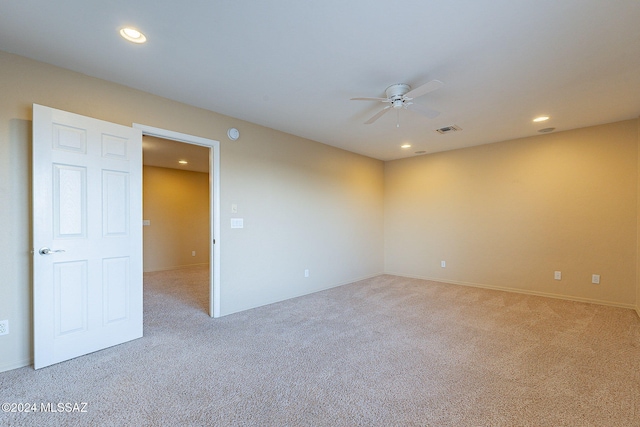 unfurnished room featuring carpet and ceiling fan