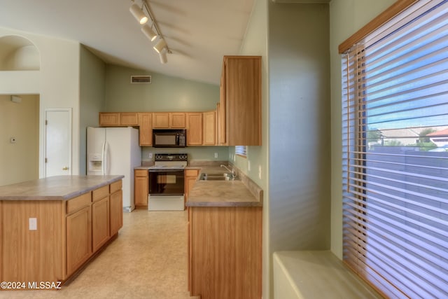 kitchen with white refrigerator with ice dispenser, lofted ceiling, electric range oven, a sink, and black microwave