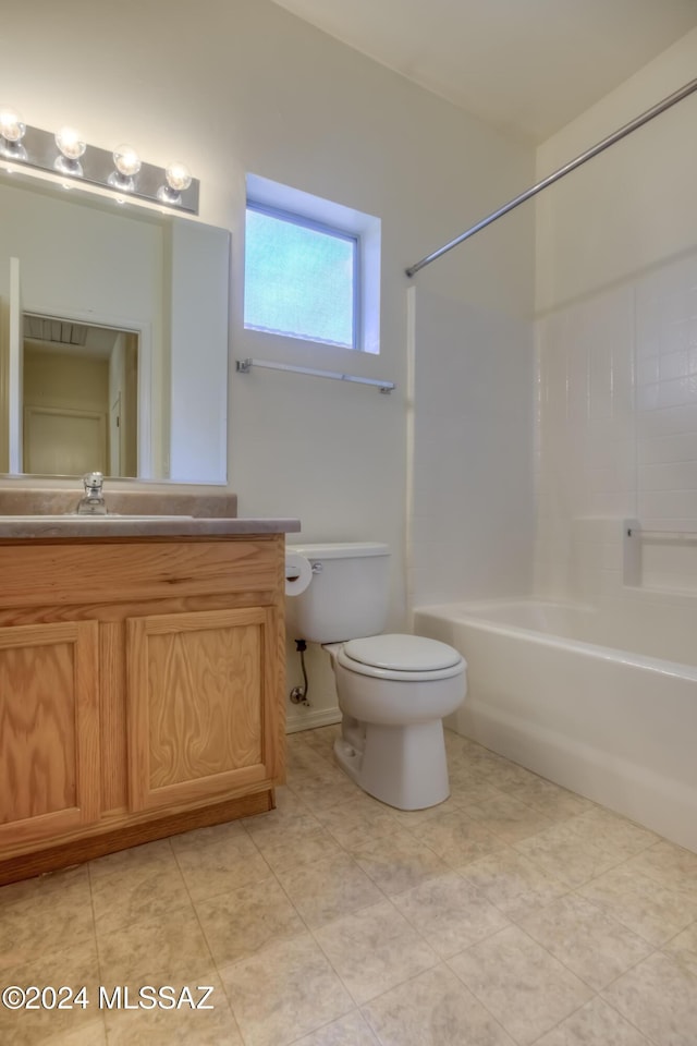 bathroom with toilet, bathing tub / shower combination, and vanity