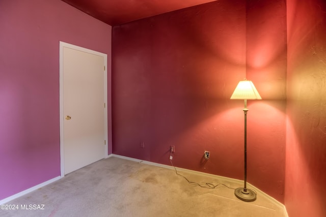 spare room with carpet floors and baseboards