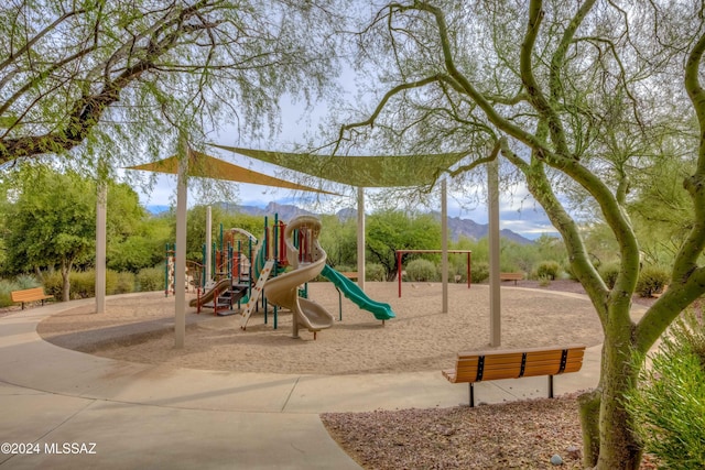 community jungle gym featuring a mountain view