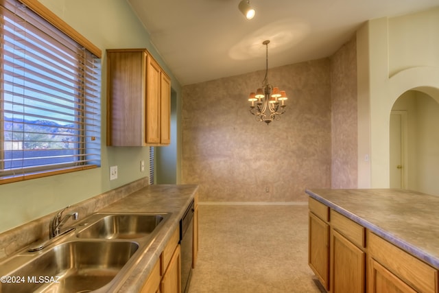 kitchen with arched walkways, dishwashing machine, brown cabinets, an inviting chandelier, and a sink