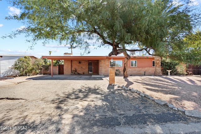 exterior space featuring a carport