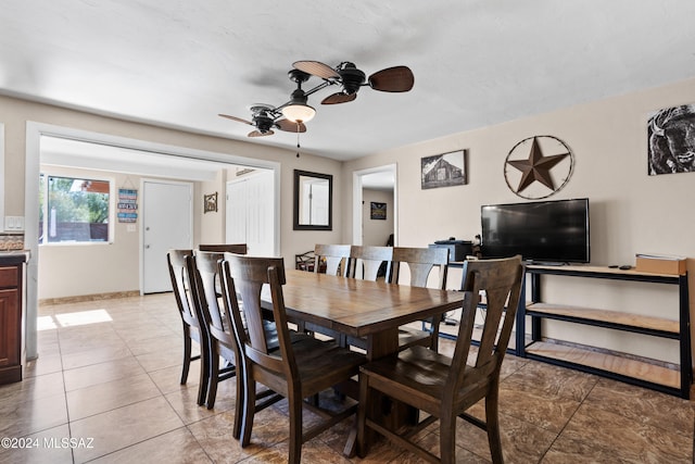 dining room featuring ceiling fan and light tile patterned flooring