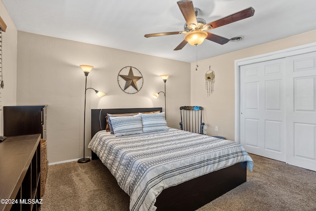 carpeted bedroom with a closet and ceiling fan